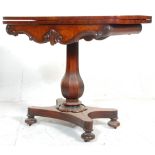 A 19th century Regency William IV mahogany card - games table. Raised on a quadruped base with bun