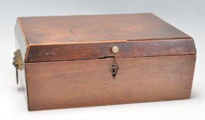 A 19th Century Georgian mahogany rectangular games box having lion head mask handles with a small