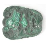 A good quality malachite belt buckle in the form of a horned chinese demon with a yin and yang