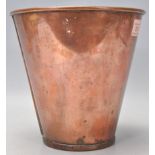 A vintage copper ice bucket of tapering form having a banded rim. Measures 19cm tall with a diameter