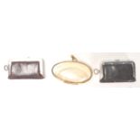 Two 19th Century Victorian leather sovereign purses having push button clasps with fitted interior