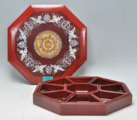 A 20th Century Chinese lacquered octagonal sectional wooden box having intricate mother of pearl