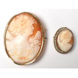 Two vintage 20th Century cameo brooches having carved conch shell panels,  both set in yellow