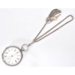 A 19th Century Victorian silver hallmarked open face pocket watch. The white enamel face having a