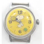 A rare 1958 Timex Snoopy wristwatch with yellow dial. The Timex movement in stainless steel case