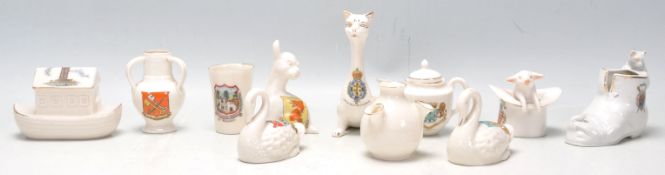 A collection Goss ware china to include Eastbourne pig in a hat, Santa Cruz De Tenerife cat,