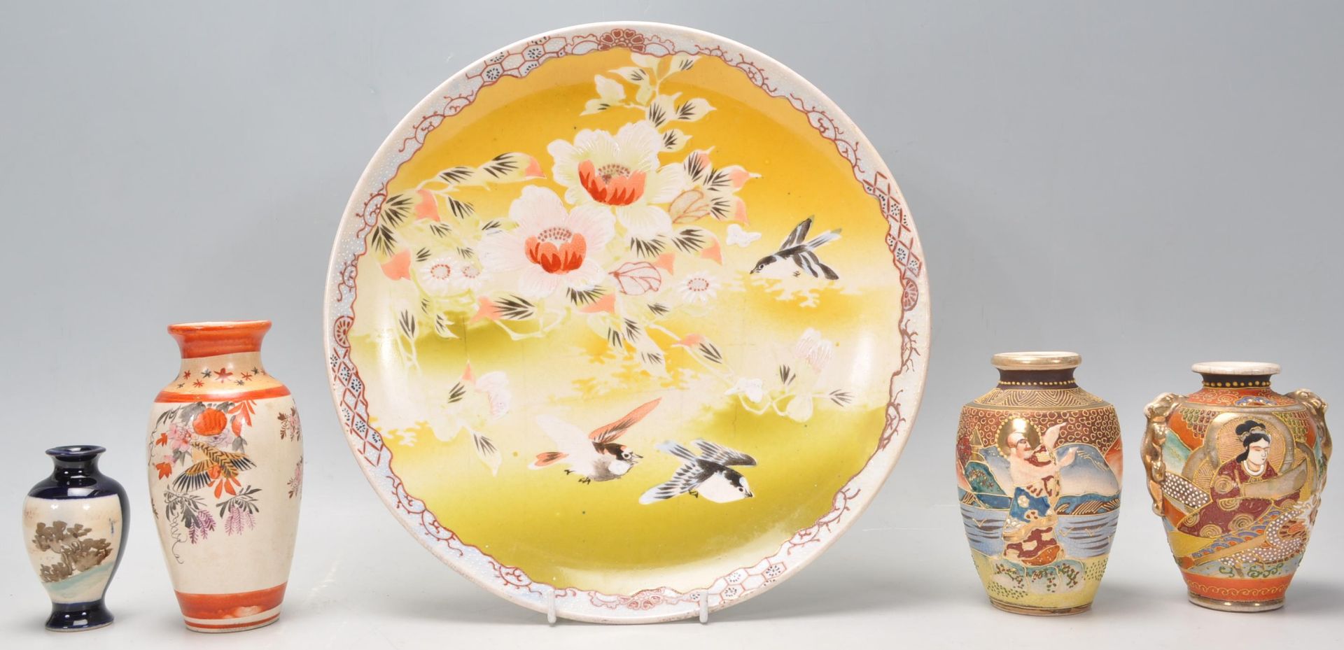 A mixed group of Japanese ceramics dating from the early 20th Century to include a hand decorated