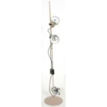 A vintage retro mid 20th century 1960's 1970's floor standing spotlight lamp having a round base