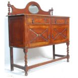 A 1930's oak mirror back sideboard / serving cabinet having two drawers with two cupboards below