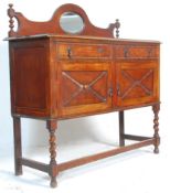 A 1930's oak mirror back sideboard / serving cabinet having two drawers with two cupboards below