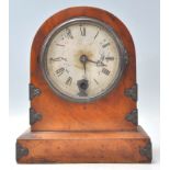 A 19th century English walnut cased mantel clock with 24 hour brass movement. The clock on plinth
