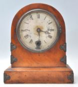 A 19th century English walnut cased mantel clock with 24 hour brass movement. The clock on plinth
