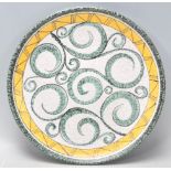 A mid 20th century retro studio art pottery centre piece bowl with geometric decoration having swirl