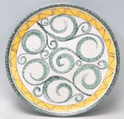 A mid 20th century retro studio art pottery centre piece bowl with geometric decoration having swirl