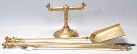 A 19th Century Georgian brass fireside companion set polished brass fireside companion set