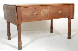 A Victorian 19th century country pine scullery table. Raised on turned and inverted tapering legs