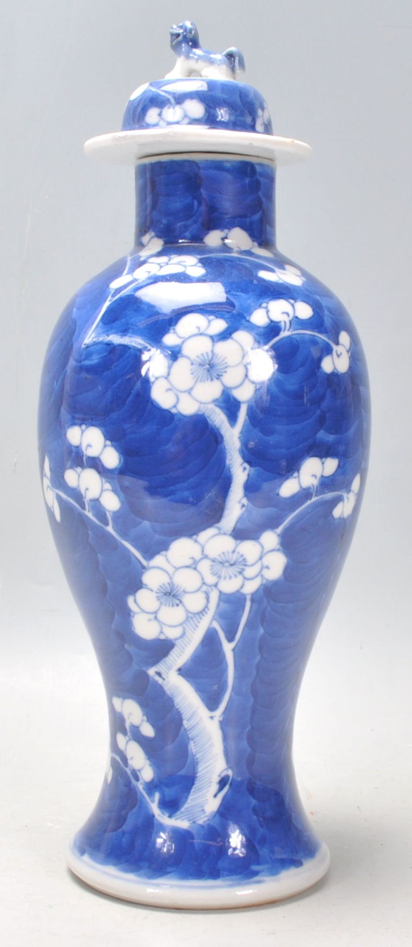 A late 19th Century Chinese blue and white baluster vase hand painted in the prunus pattern,