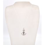 A stamped sterling silver necklace in the shape of anchor and ships wheel with a rope chain and