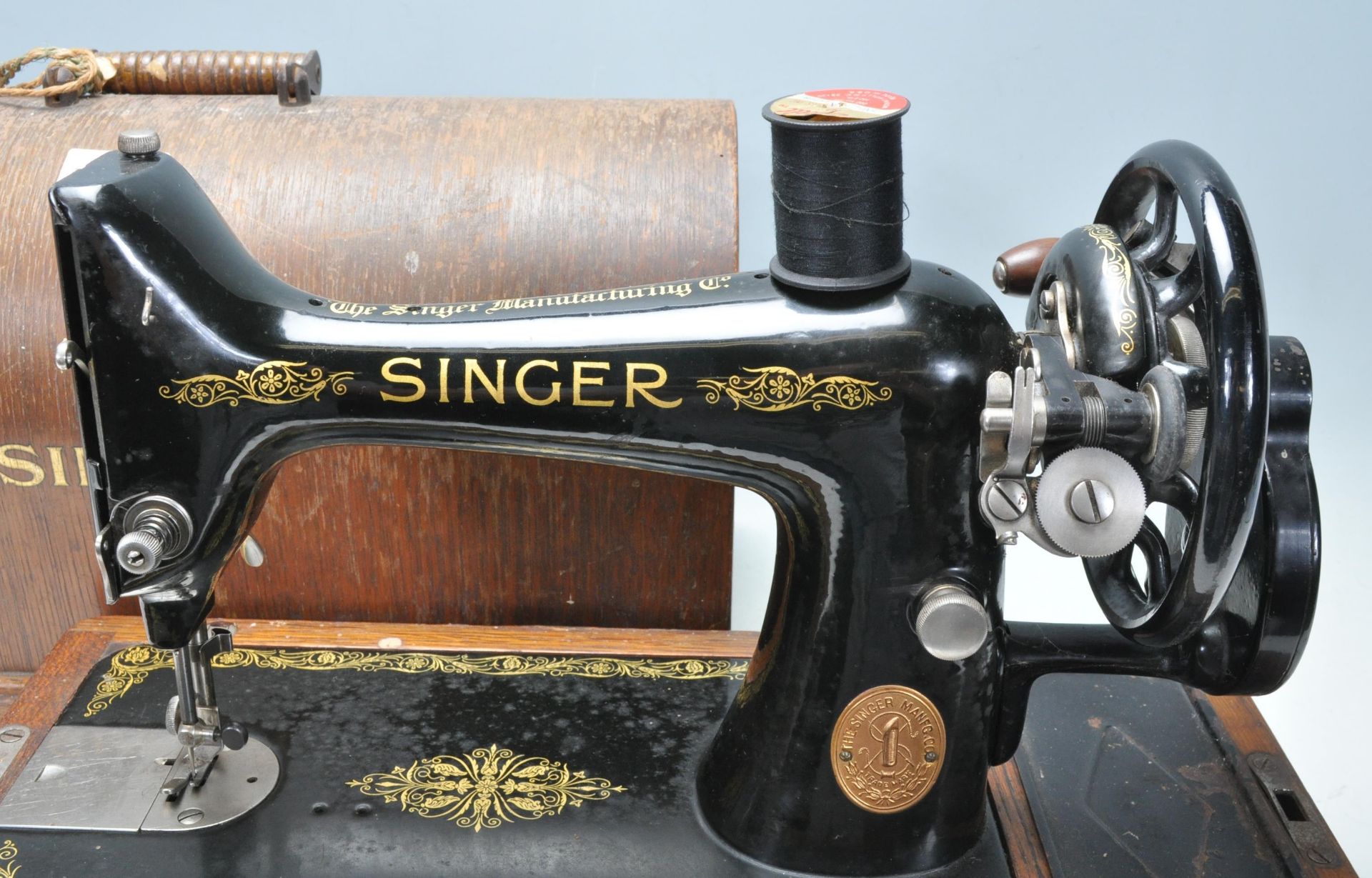 A 19th Century Victorian Singer sewing machine having an ebonised metal body set within a wooden - Image 5 of 5