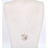 A stamped sterling silver CZ and blister pearl heart shaped pendant necklace on a snake chain held