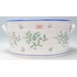 An antique 19th century Victorian Copeland Spode made ceramic footbath. Decorated with florals to
