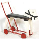 A vintage 20th Century push / ride along horse constructed form wood and metal finished in white and