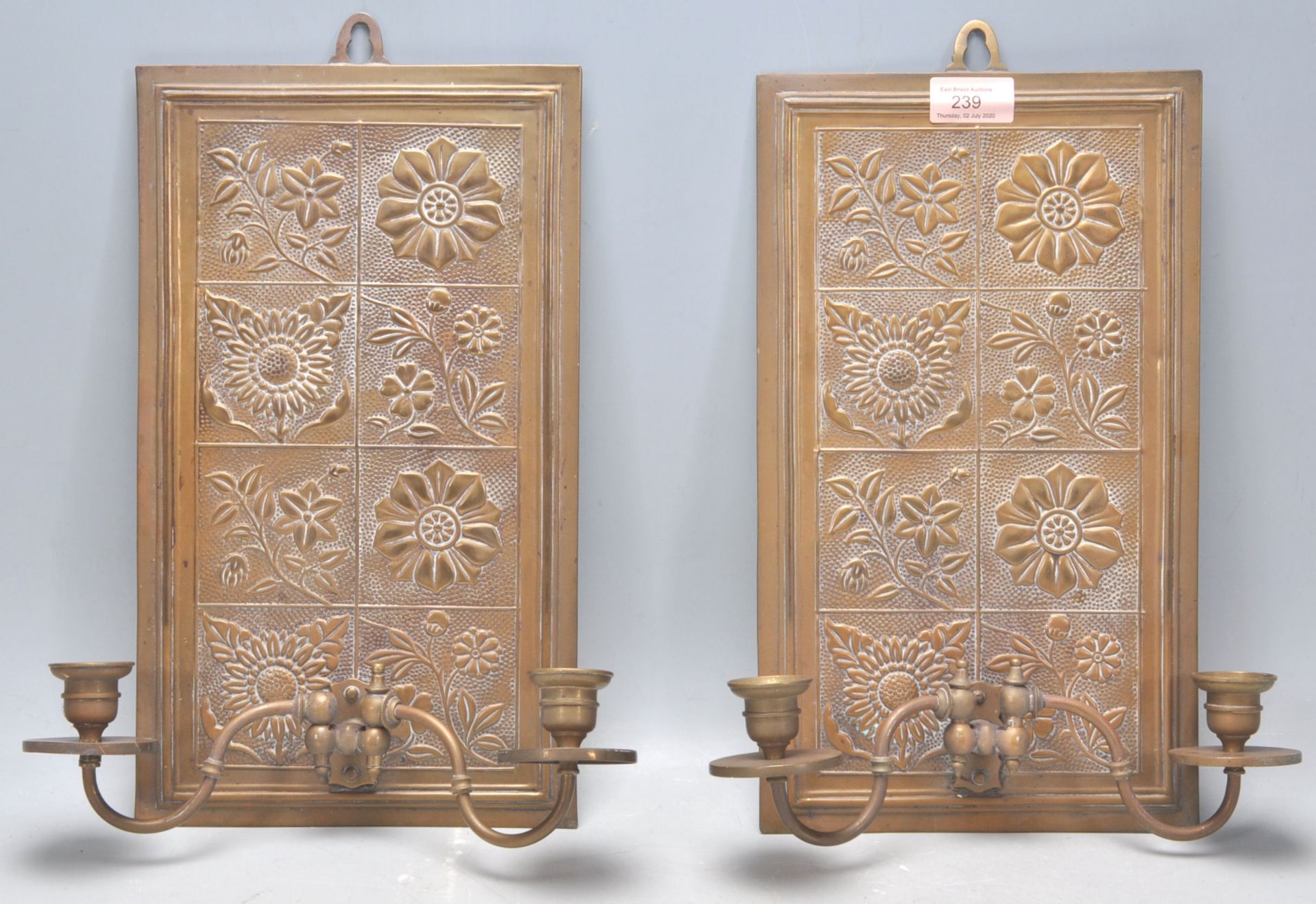 A pair of late 19th Century Victorian Aesthetic movement Arts and Crafts wall mounting brass