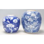 A large 19th century Chinese ginger jar of bulbous form being hand painted in blue and white in