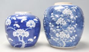 A large 19th century Chinese ginger jar of bulbous form being hand painted in blue and white in
