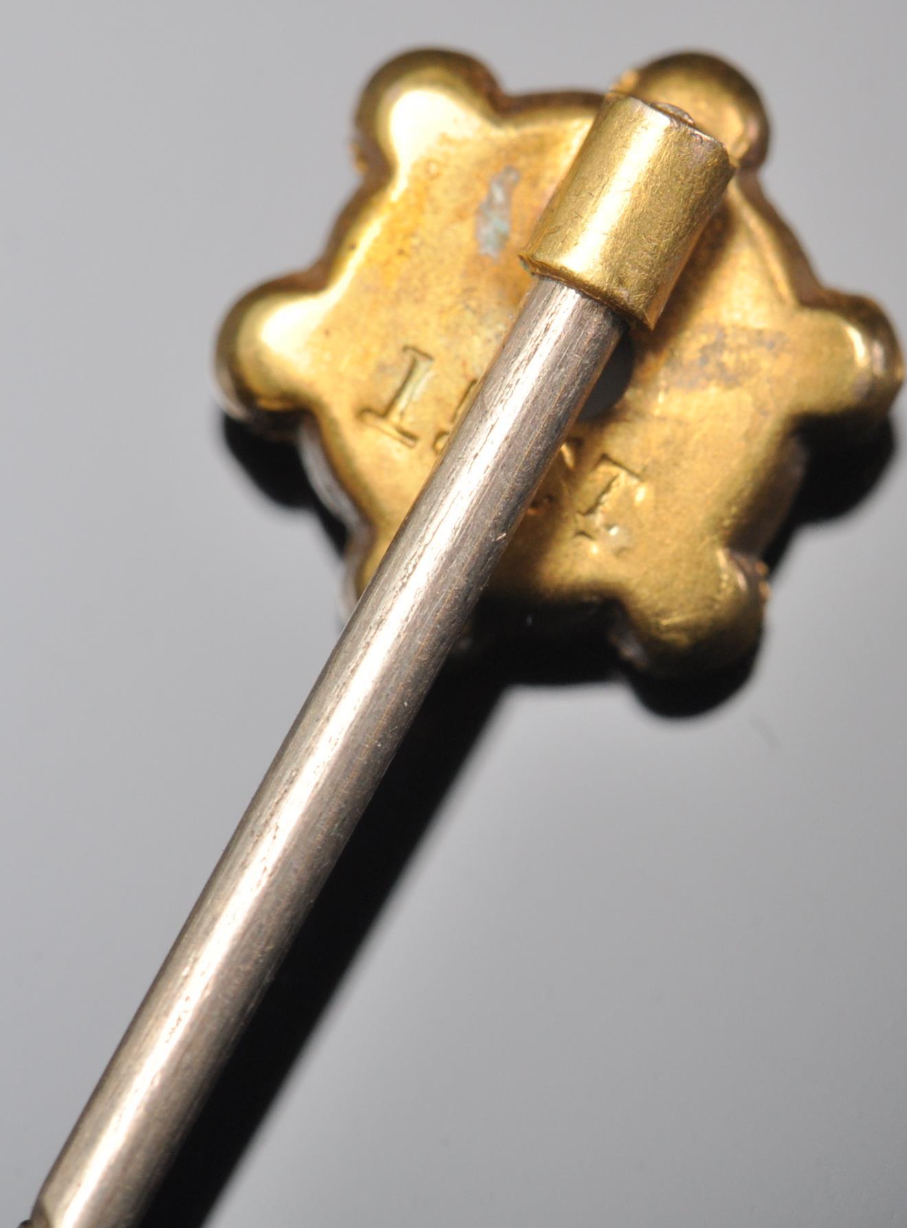 A 9ct gold toped tie pin having wire work and ball finial decoration set with a single diamond chip. - Image 5 of 5
