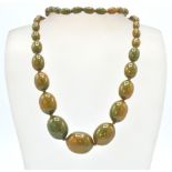 An early 20th Century 1930's early plastic / bakelite graduating beaded necklace with green and