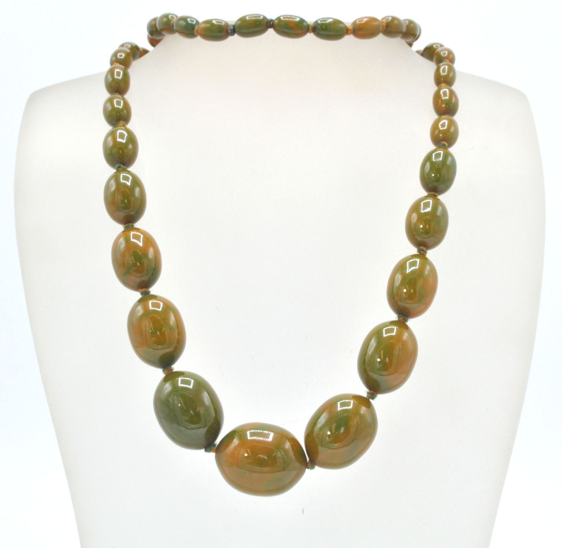 An early 20th Century 1930's early plastic / bakelite graduating beaded necklace with green and