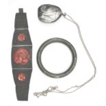 A Chinese cinnabar and white metal strap bracelet inset with inset cinnabar roundels. The verso