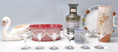 A set of six vintage retro Babycham advertising glasses having gilt rims with hexagonal stems and