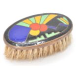 A lovely early 20th Century Art Deco miniature brush having an enameled top with a black ground