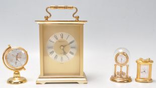 A vintage 20th Century brass cased carriage clock by President having gilt brushed design interior