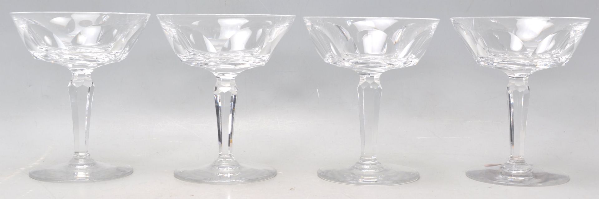 A set of four vintage Waterford crystal cut glass champagne / cocktail glasses having wide faceted