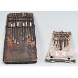 Two African metal Kilimba / Sansa thumb piano' s to include one having a square wooden base with