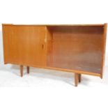 A 1970's retro vintage teak wood sideboard credenza / display cabinet having large glazed sliding