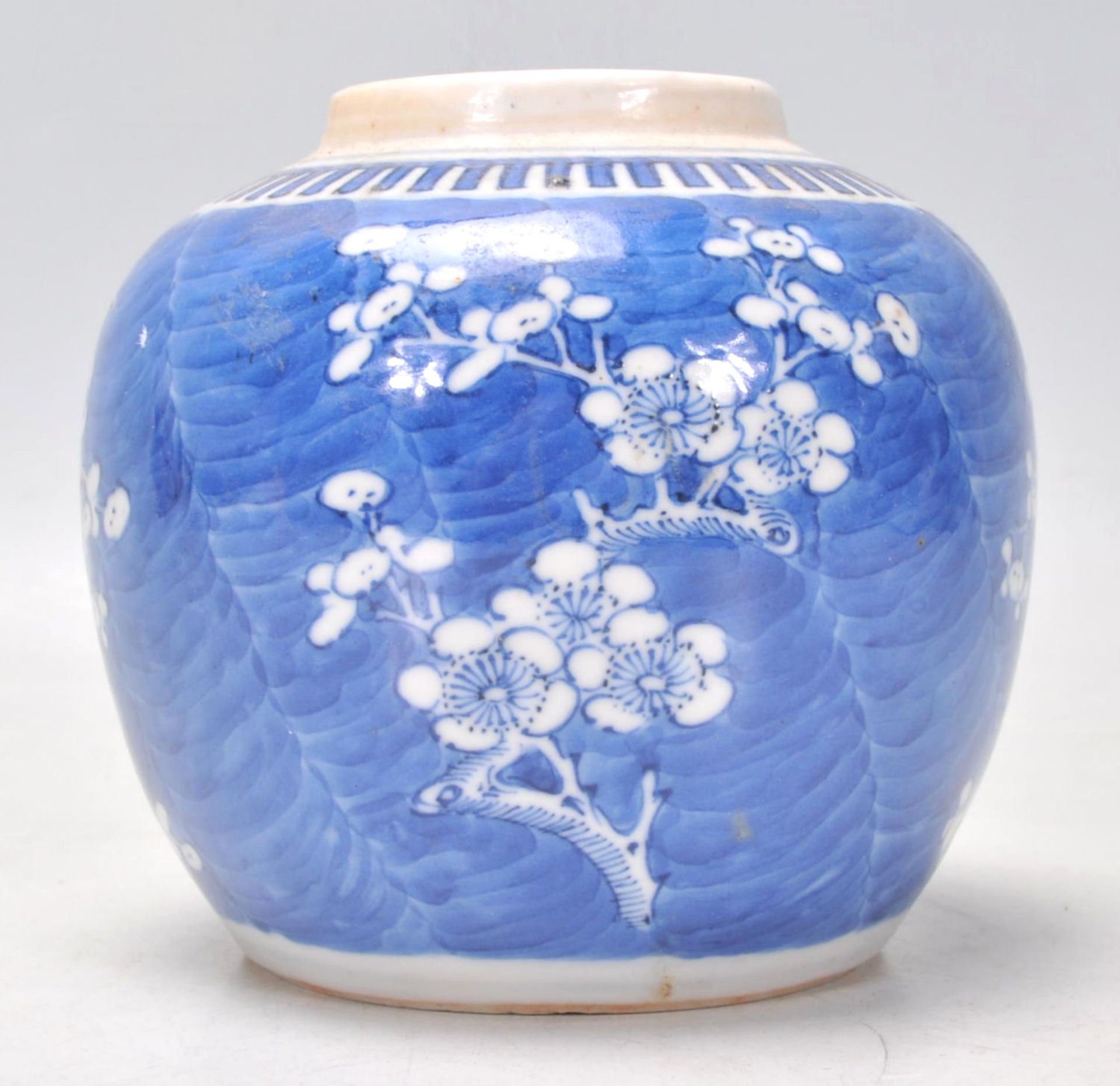 A 19th Century Chinese ginger jar hand painted in the prunus pattern with a key border to the top