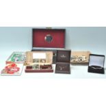 A collection of vintage costume jewellery across multiple jewellery boxes to include a wide