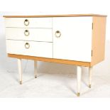 A retro vintage 20th Century white melamine sideboard credenza of good small proportions having a