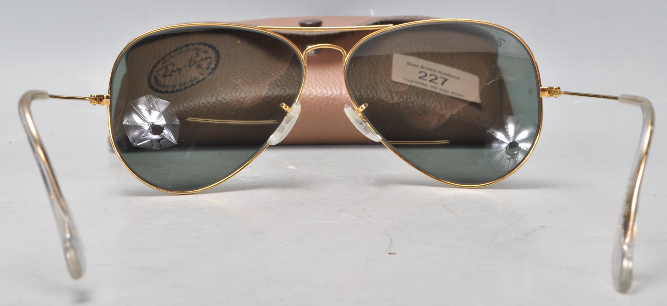 A pair of vintage gentlemen's Ray Ban aviator sunglasses having gilt wire frames and dark lenses, - Image 5 of 7