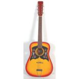 A vintage Korean made six string acoustic guitar having a sunburst finish body with dual scratch