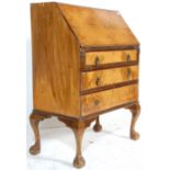 An early 20th Century  1930's Queen Anne walnut writing bureau fall front desk having a bank of