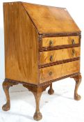 An early 20th Century  1930's Queen Anne walnut writing bureau fall front desk having a bank of