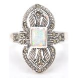 A stamped sterling silver art deco style dress ring decorated with marcasite and a central opal