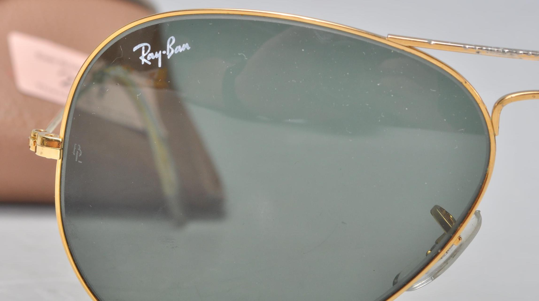 A pair of vintage gentlemen's Ray Ban aviator sunglasses having gilt wire frames and dark lenses, - Image 4 of 7