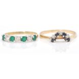 A hallmarked 9ct gold emerald and diamond 7 stone ring. The emeralds and diamonds of mixed cut.