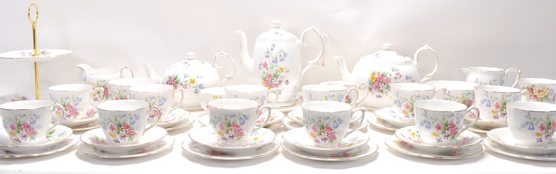 A Fine Bone China English tea service by Queen Anne China in the Old Country Spray pattern having